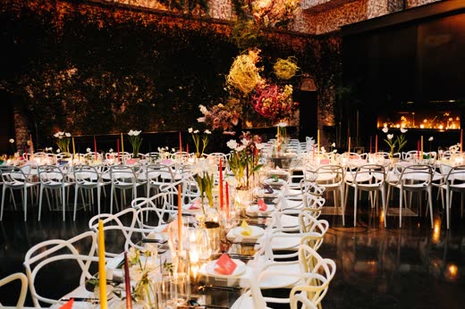 A long candlelit dinner under hanging greenery at The Foundry