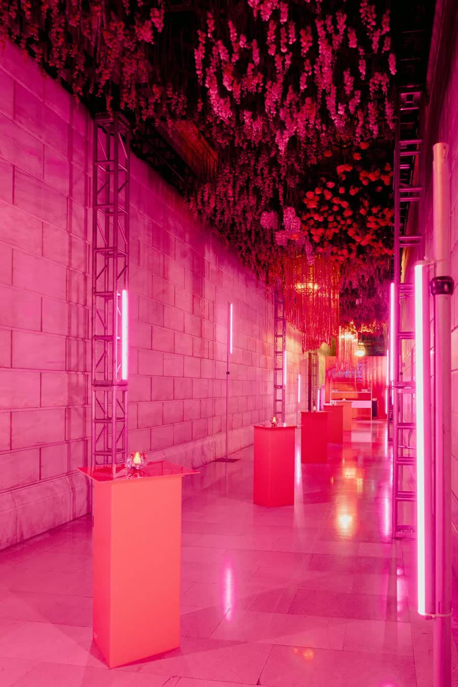 A hot-pink lit corridor at The Knot Gala