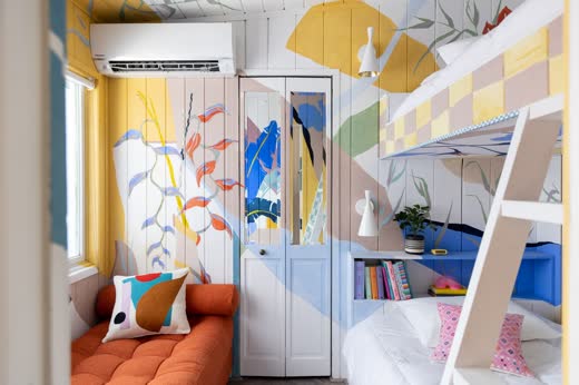 A bunk room with a colourful painted mural