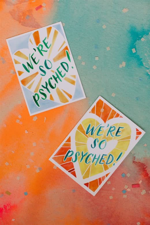 Hand-painted wedding signage in bright colours