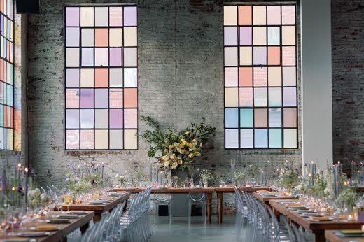 Long tables under coloured stained-glass windows